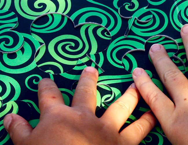 Find me! Fingers of children reading a tactile board