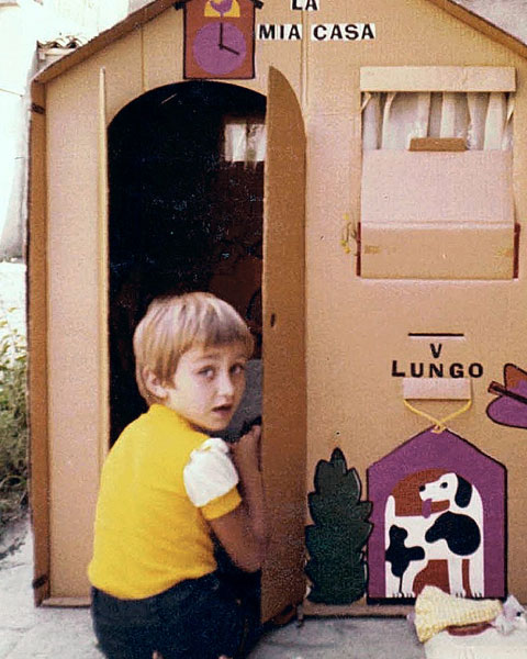 Valentina Lungo little girl playing with her cardboard house