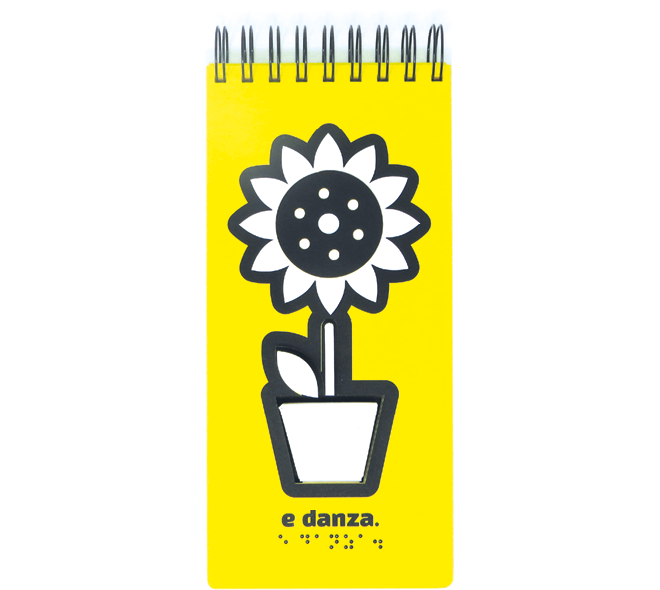 In the next, the tactile illustration shows the sunflower in bloom. “e danza” in text and Braille